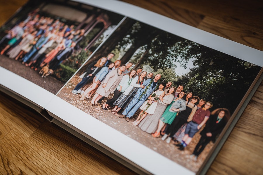 A spread in a wedding album showing family portraits taken by Portland Wedding photographer Kyle Carnes.