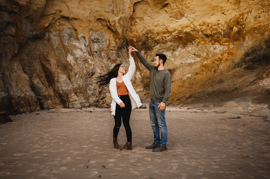 Couple dancing on beach in Oregon